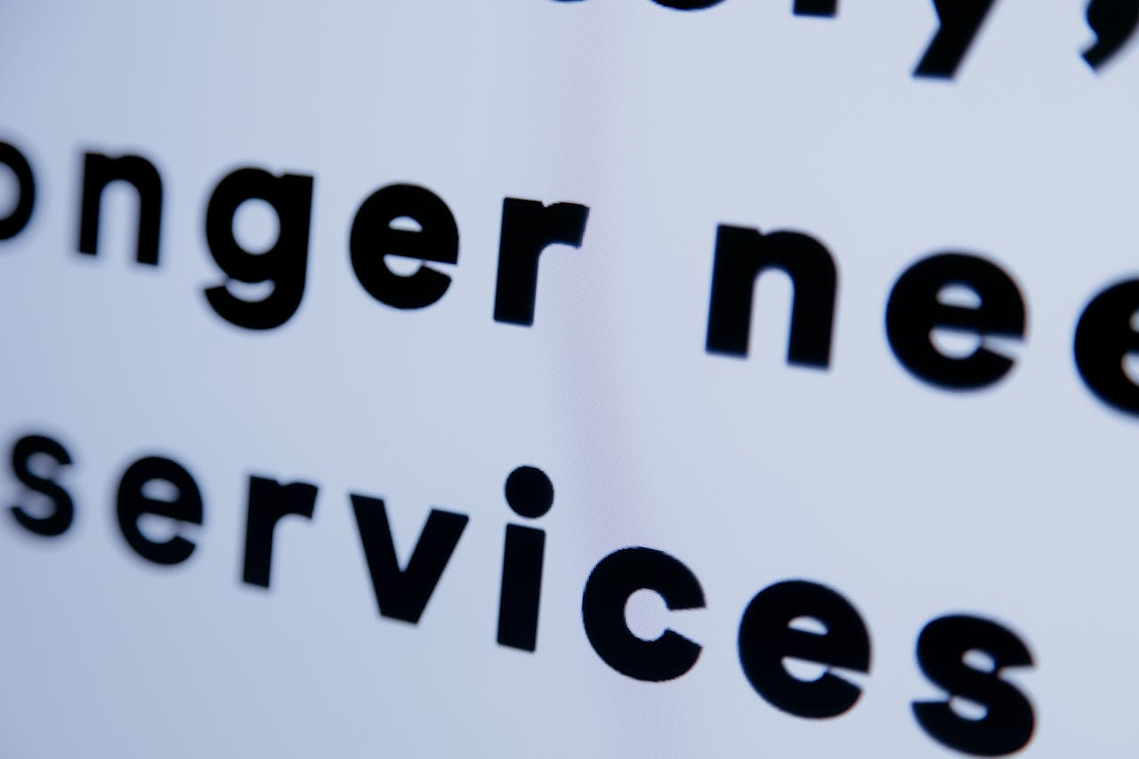 Close-up of black text on a white screen emphasizing 'services'.